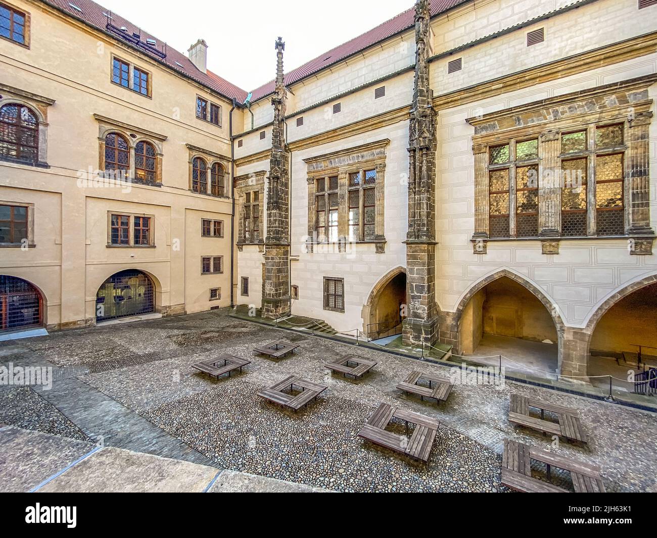 Narrow streets, stairs and wonderful palaces in Prague Castle. A unique sight without a crowd of tourists on a wonderful spring morning. Prague Castle Stock Photo