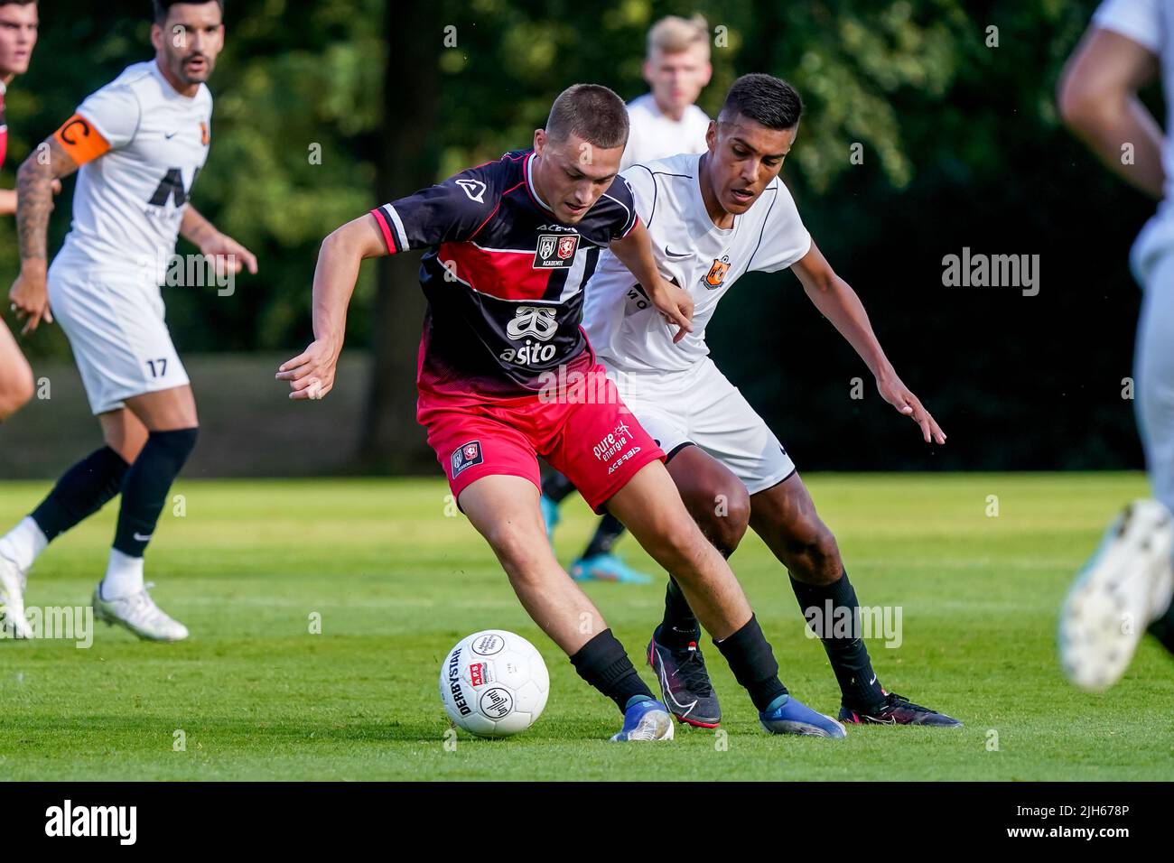 DELDEN, NETHERLANDS - JULY 15: Samir el Messaoudi of Jong Twente, Giovanni Aronds of HHC Hardenberg during the Preseason Friendly match between Jong Twente and HHC Hardenberg at Sportpark De Mors on July 15, 2022 in Delden, Netherlands (Photo by Jeroen Meuwsen) Credit: Orange Pics BV/Alamy Live News Stock Photo