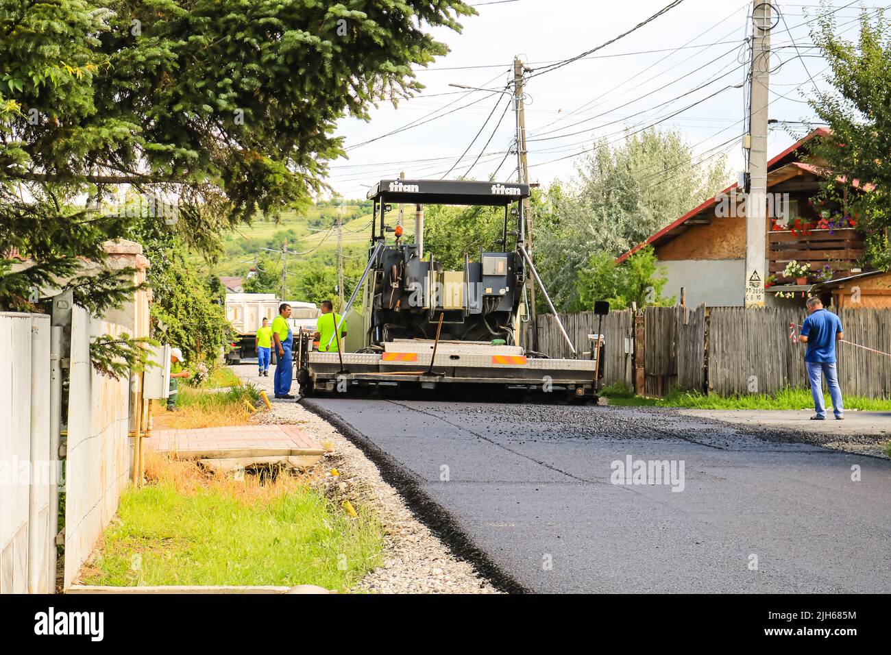 Workers and asphalting machines. Construction, asphalting of new road ...
