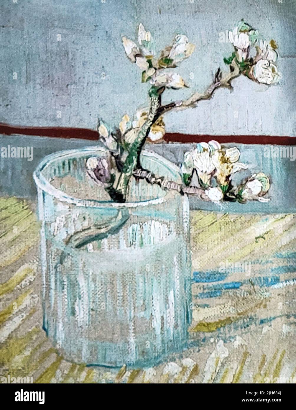 Close up of a Vincent Van Gogh oil painting of a single blossoming almond branch in a water glass Stock Photo