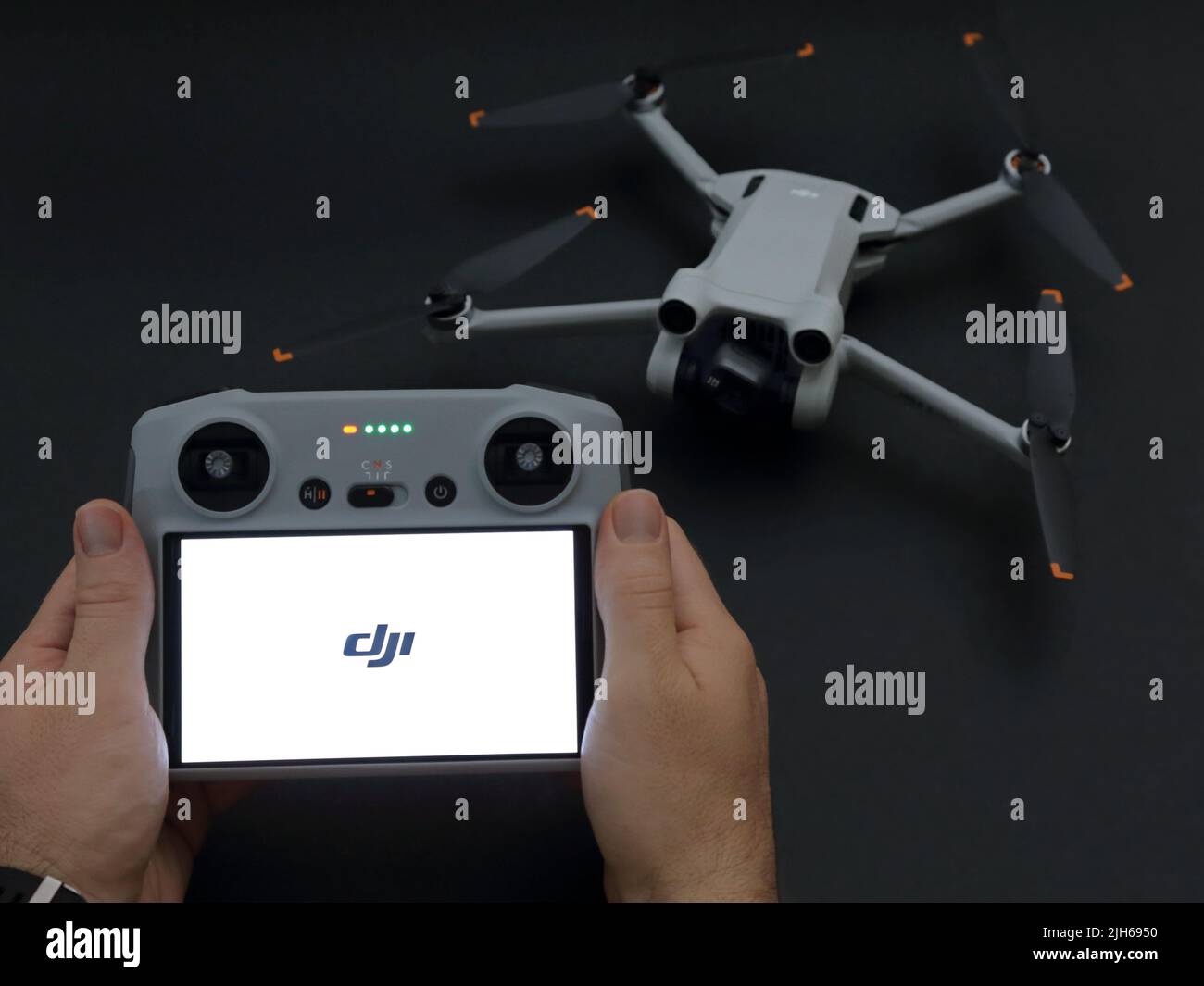 USA - July 14, 2022: A DJI remote controller, which has been newly-introduced in 2022, is shown featured, with a Mini 3 Pro drone / UAV. Stock Photo