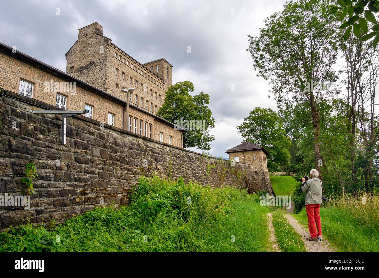 Photographer taking pictures of Generaloberst Beck barracks, former Nazi order castle called the Burg, Sonthofen, Allgaeu, Bavaria, Germany Stock Photo