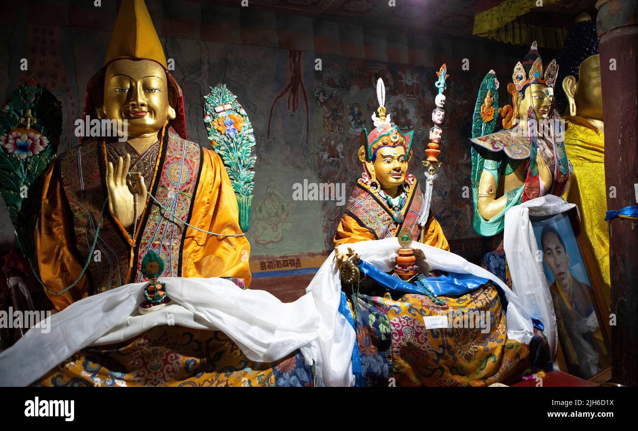 Buddhist lama statues with prayer shawls, Thiksey Monastery or Thikse Gompa, Ladakh, India Stock Photo