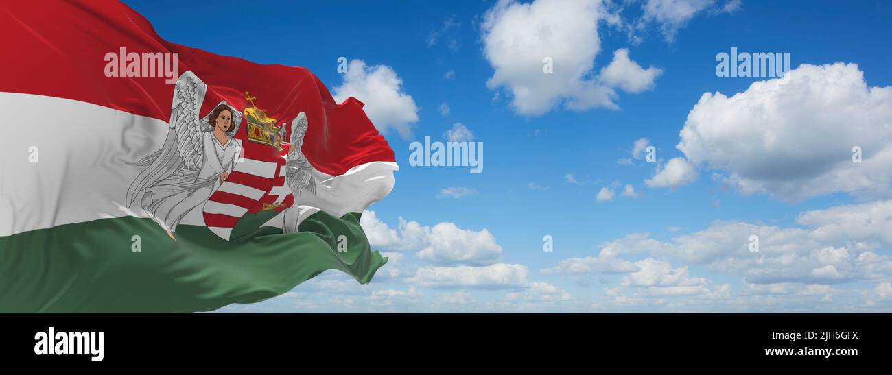 official flag of Hungary 1915 1918 Austria at cloudy sky background on sunset, panoramic view. Austrian travel and patriot concept. copy space for wid Stock Photo