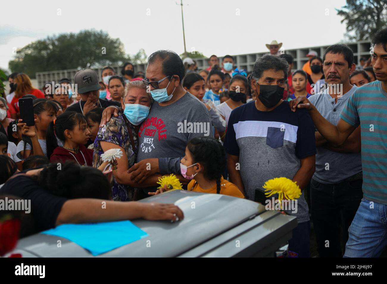 Relatives and friends of late migrant Jose Lopez, 34, who died in a trailer truck in Texas attend his funeral after his remains were repatriated to Mexico, in Celaya, Guanajuato state, Mexico, July 15, 2022. REUTERS/Edgard Garrido Stock Photo