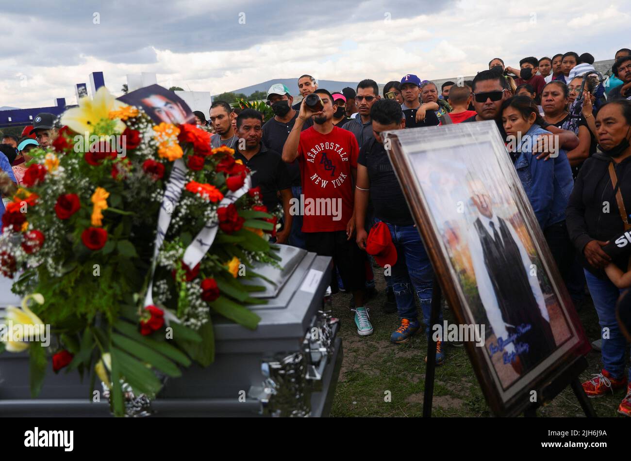 Relatives and friends of late migrant Jose Lopez, 34, who died in a trailer truck in Texas attend his funeral after his remains were repatriated to Mexico, in Celaya, Guanajuato state, Mexico, July 15, 2022. REUTERS/Edgard Garrido Stock Photo