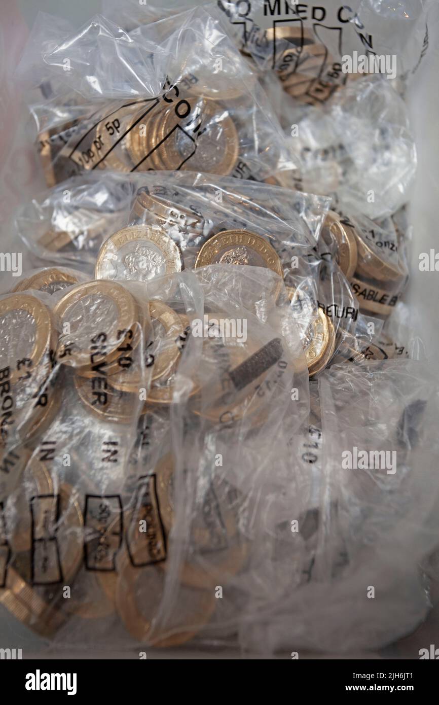 Bagged up pound coins Stock Photo