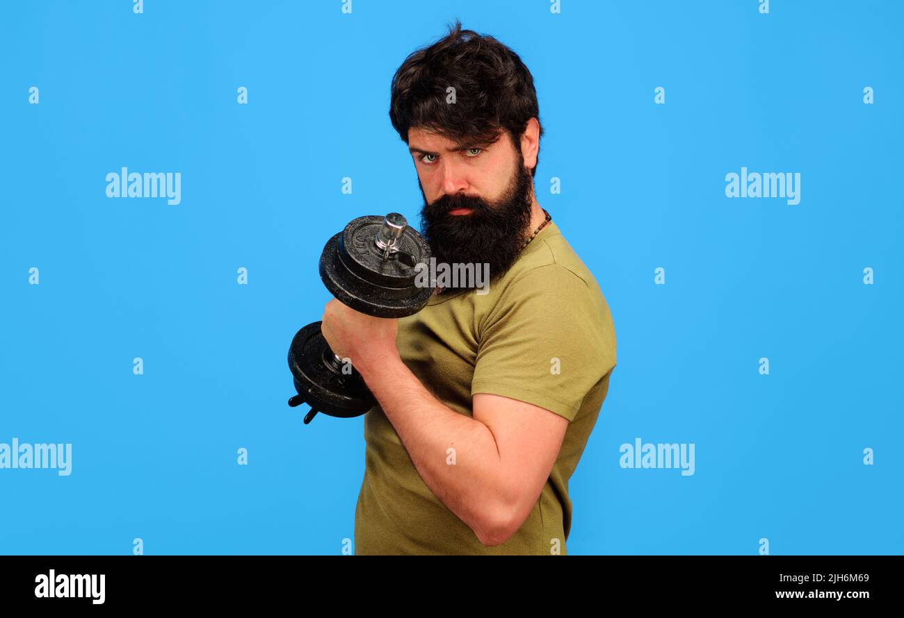 Athlete man training with dumbbell. Sportsman making weightlifting. Fitness. Muscular sportsman. Stock Photo