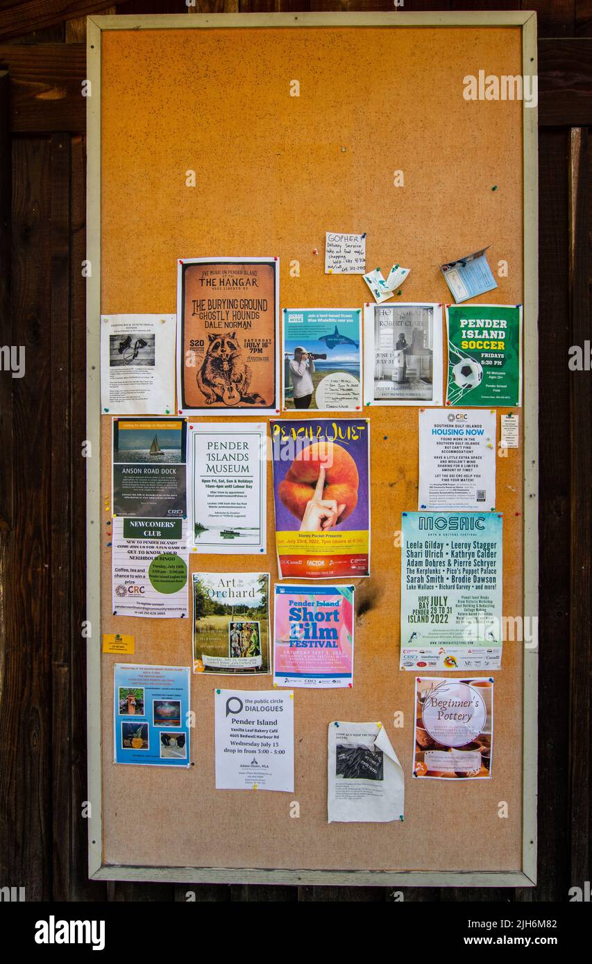 Community bulletin board at Pender Island Community Hall in North Pender Island, British Columbia, Canada Stock Photo