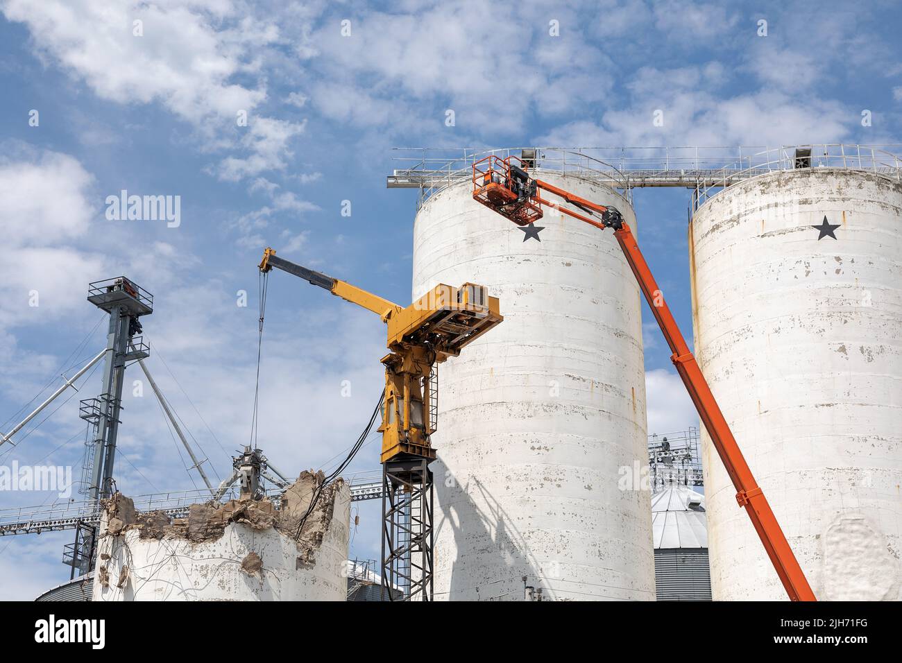 Demolition of concrete grain bins at the Agri-way grain elevator in ...