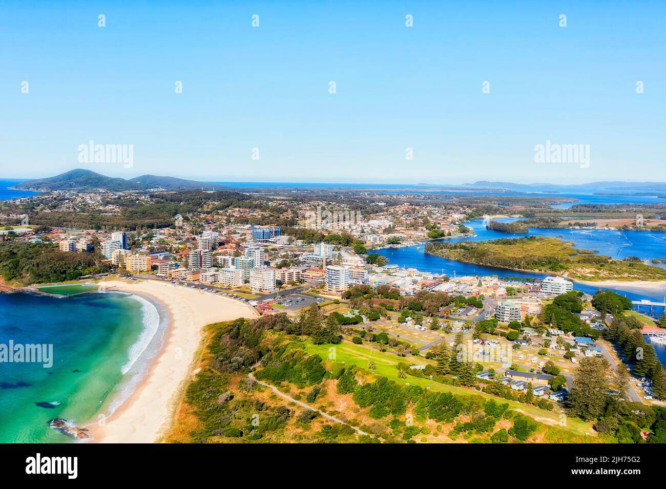 Downtown of Forster resort recreation town on Pacific Barrington coast of Australia in aerial scenic landscape view over main beach. Stock Photo