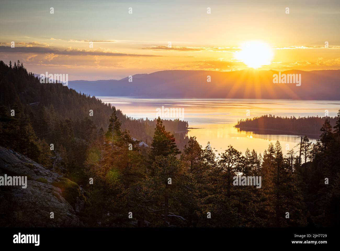 Just after sunrise on the Eagle Falls trail overlooking Emerald Bay Lake Tahoe Stock Photo
