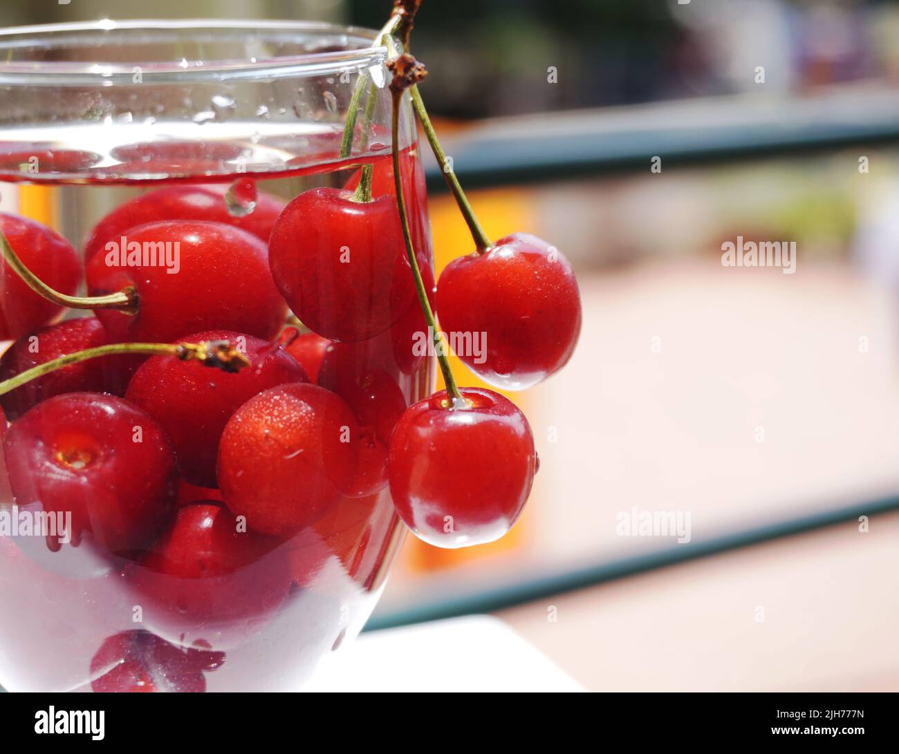 Cherry fruits in a glass , a beautiful background with organic food. Stock Photo