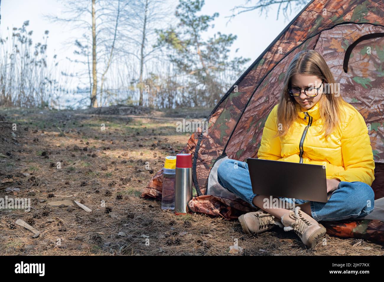 Distance learning online education and work. Woman girl working office work remotely from forest