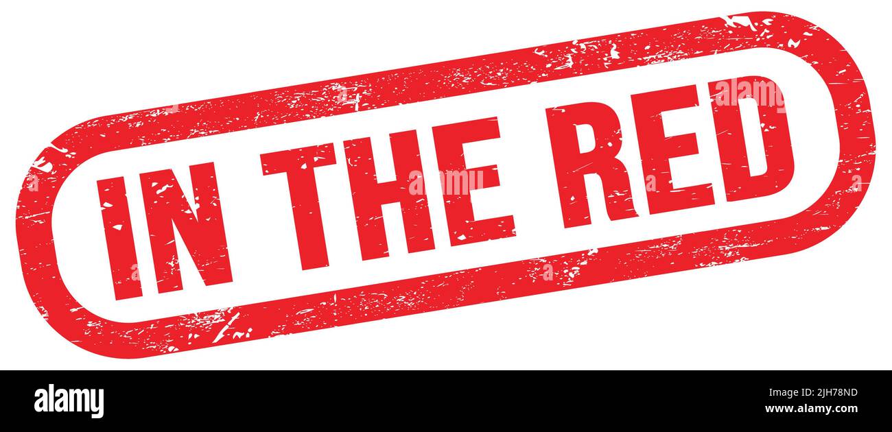 IN THE RED, text on red rectangle stamp sign Stock Photo - Alamy