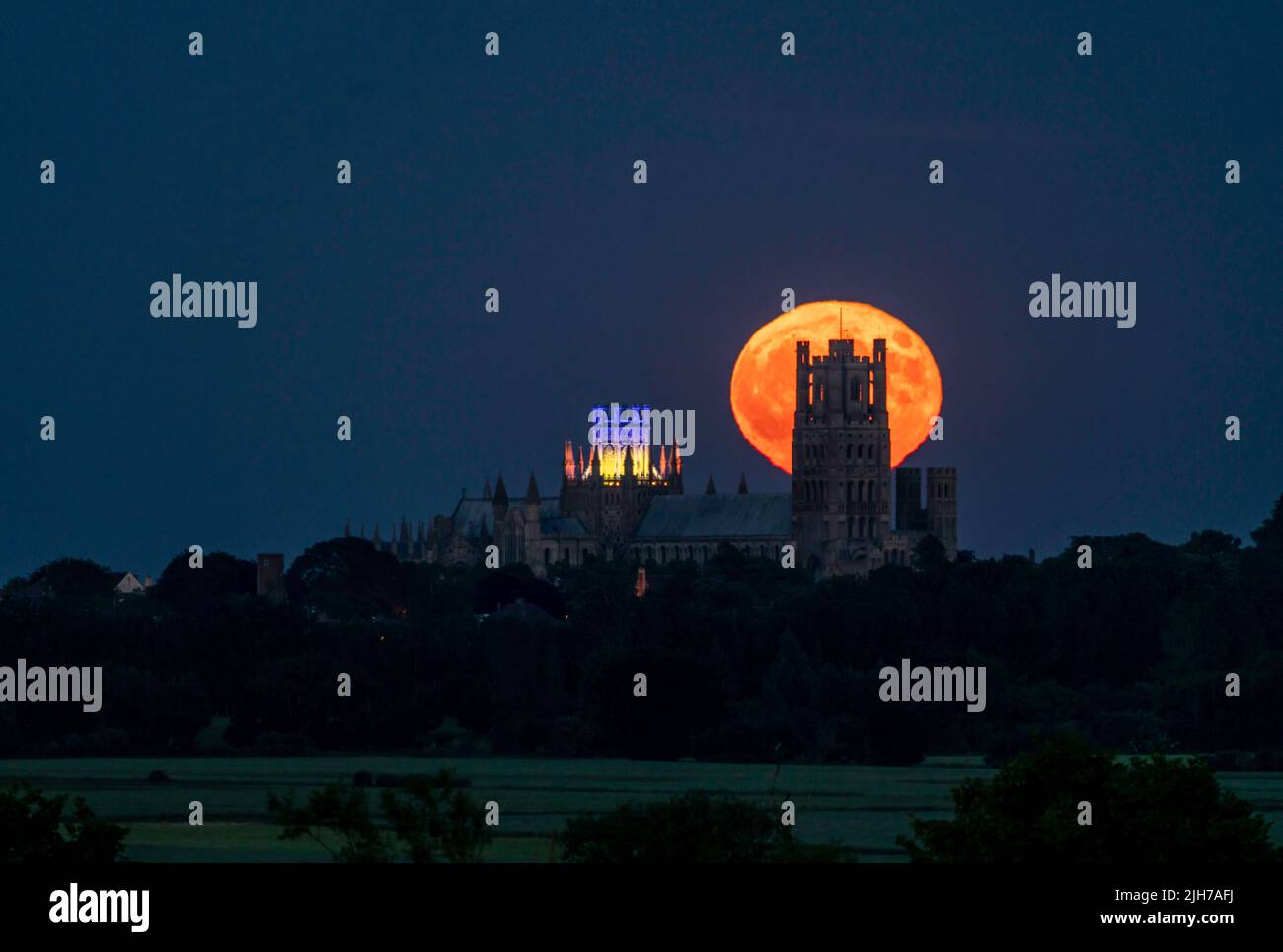 Strawberry Moon rising behind Ely Cathedral Stock Photo Alamy