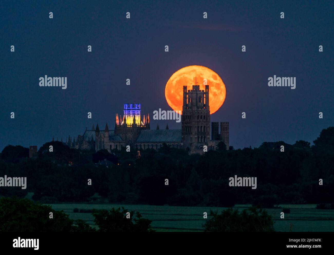 Strawberry Moon rising behind Ely Cathedral Stock Photo Alamy