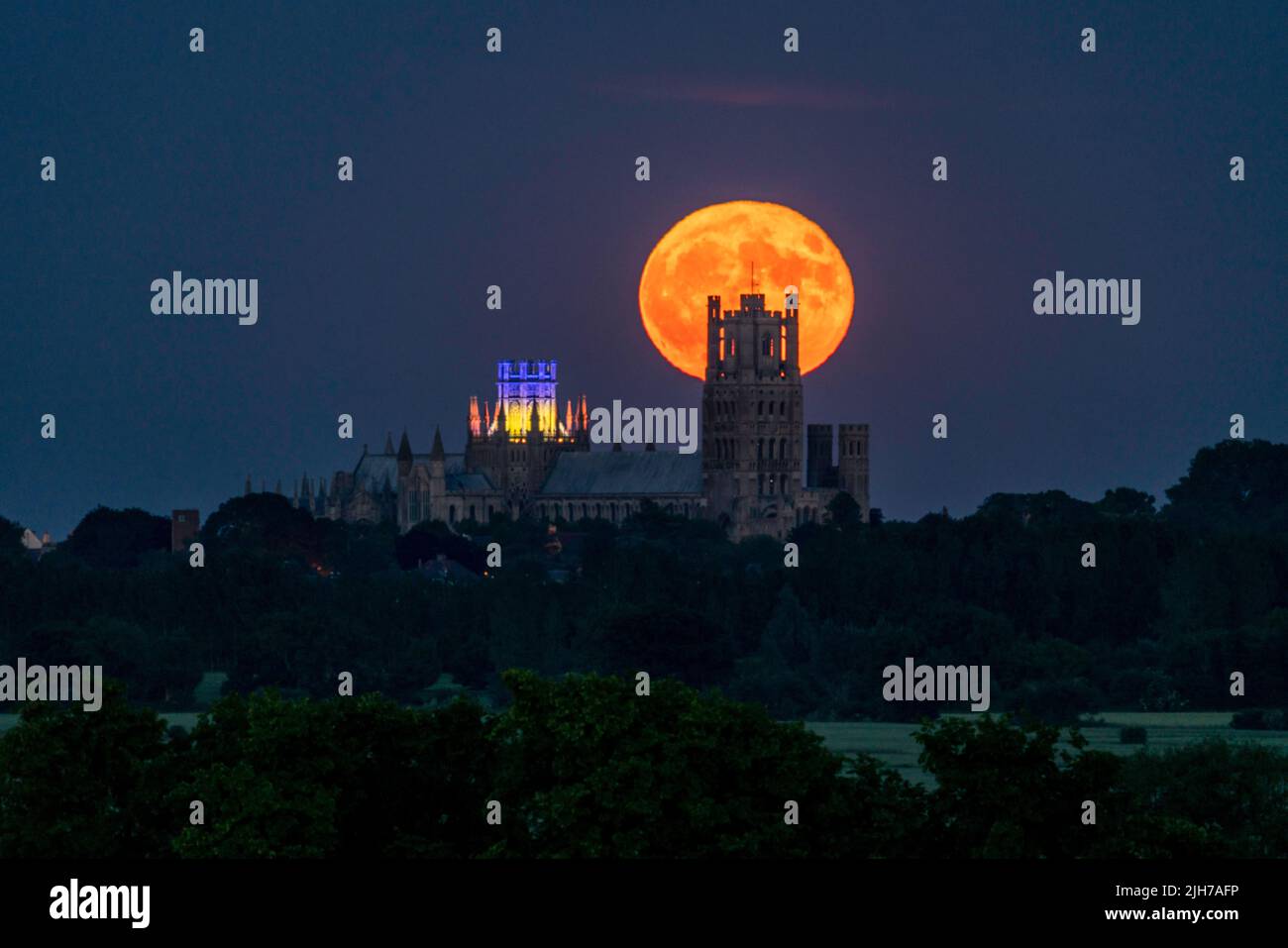 Strawberry Moon rising behind Ely Cathedral Stock Photo Alamy