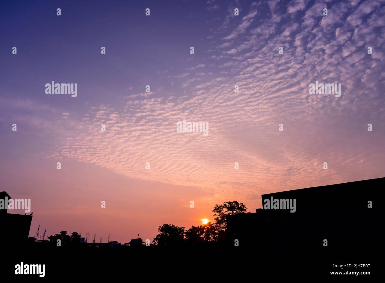 Incomparably amazing cloud formation in colourful sky during a monsoon sunrise morning in west Bengal, India Stock Photo