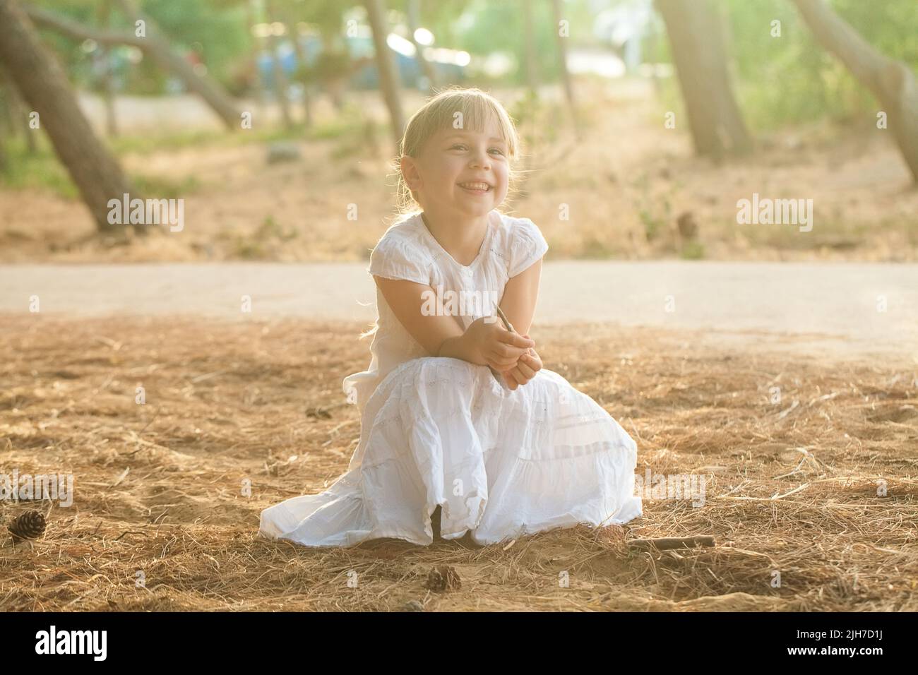 Happy child girl smiling enjoying life in nature Stock Photo - Alamy
