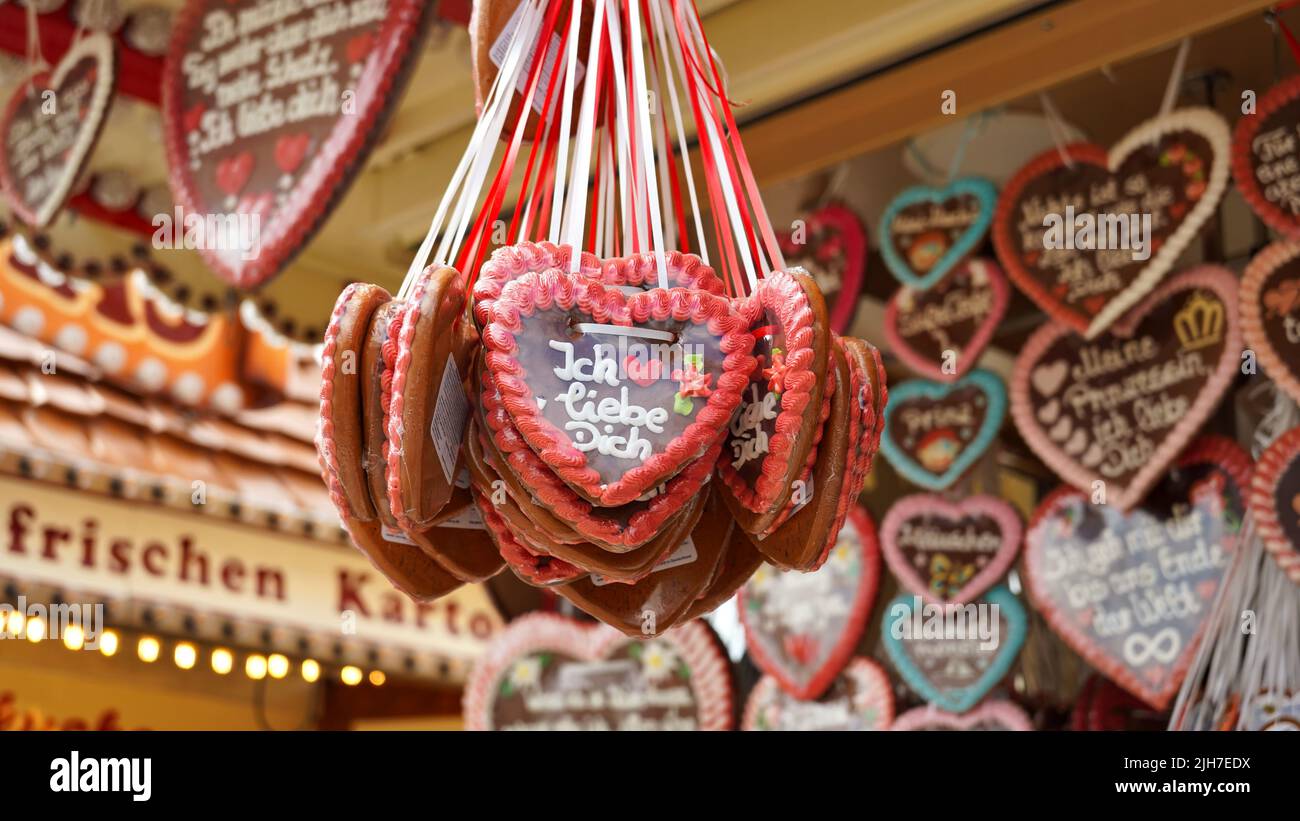 Candy stand with traditional German gingerbread hearts at the popular fun fair 'Rheinkirmes' 2022 in Düsseldorf, Germany. Stock Photo