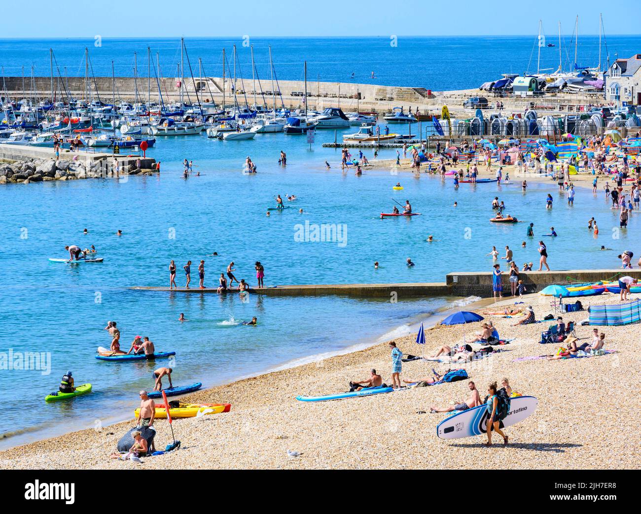 Lyme Regis, Dorset, UK. 16th July, 2022. UK Weather Crowds flock to