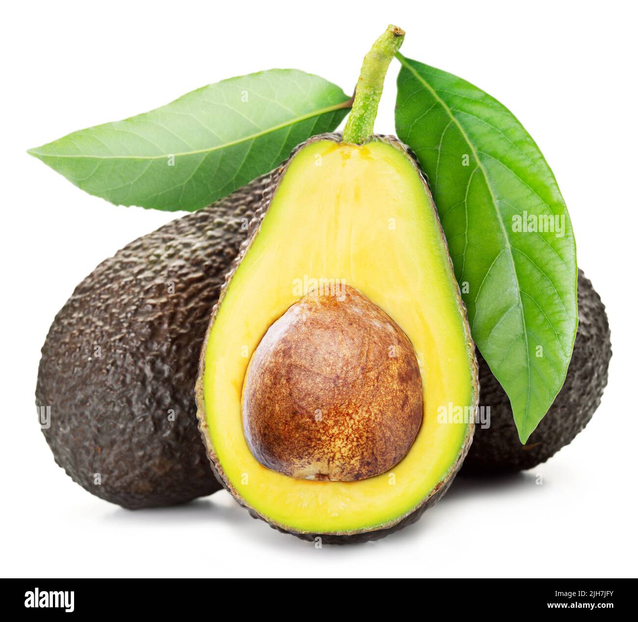 Group of fresh avocados in a green mesh bag isolated on white. One