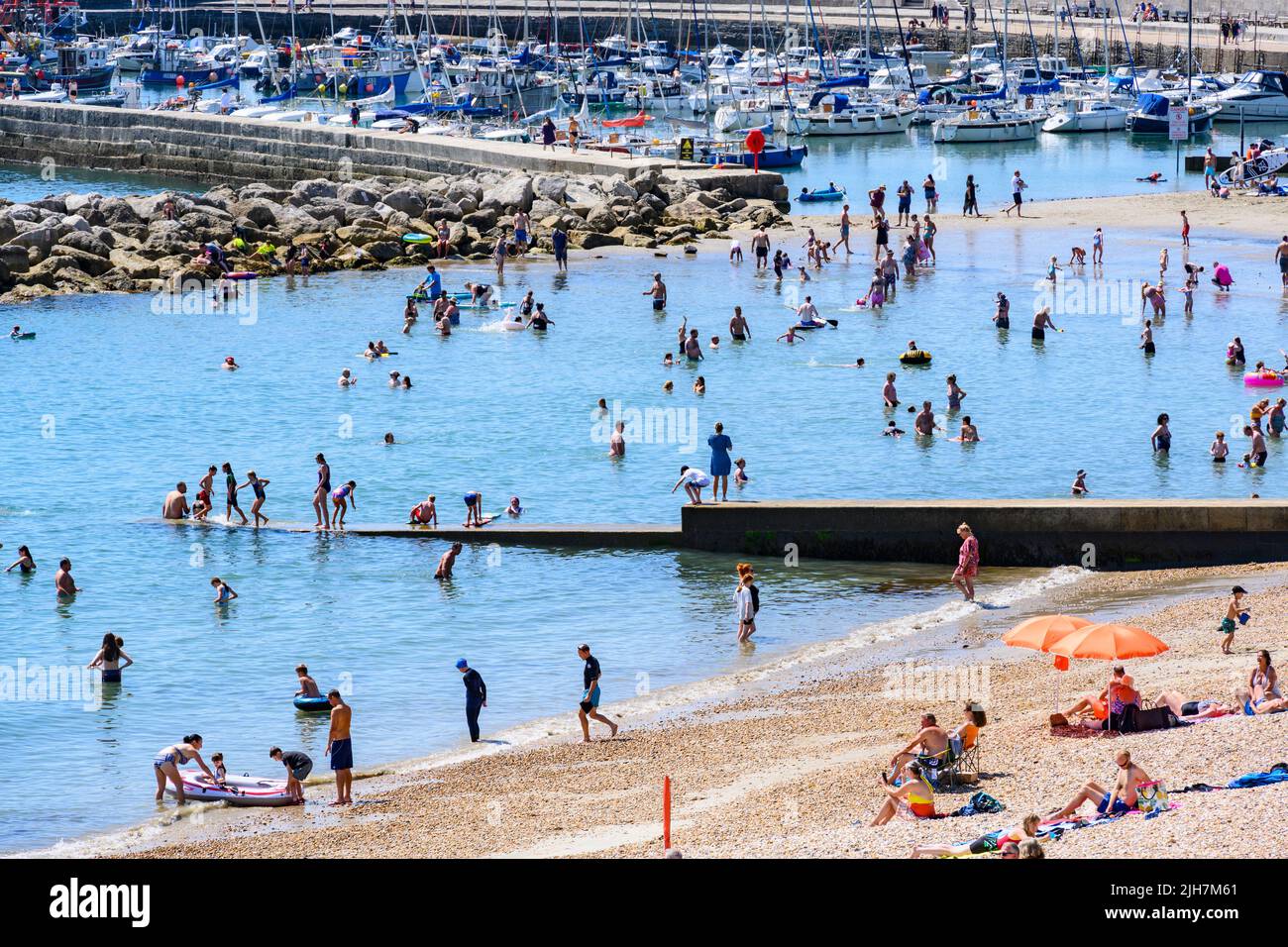 Lyme Regis, Dorset, UK. 16th July, 2022. UK Weather Crowds flock to