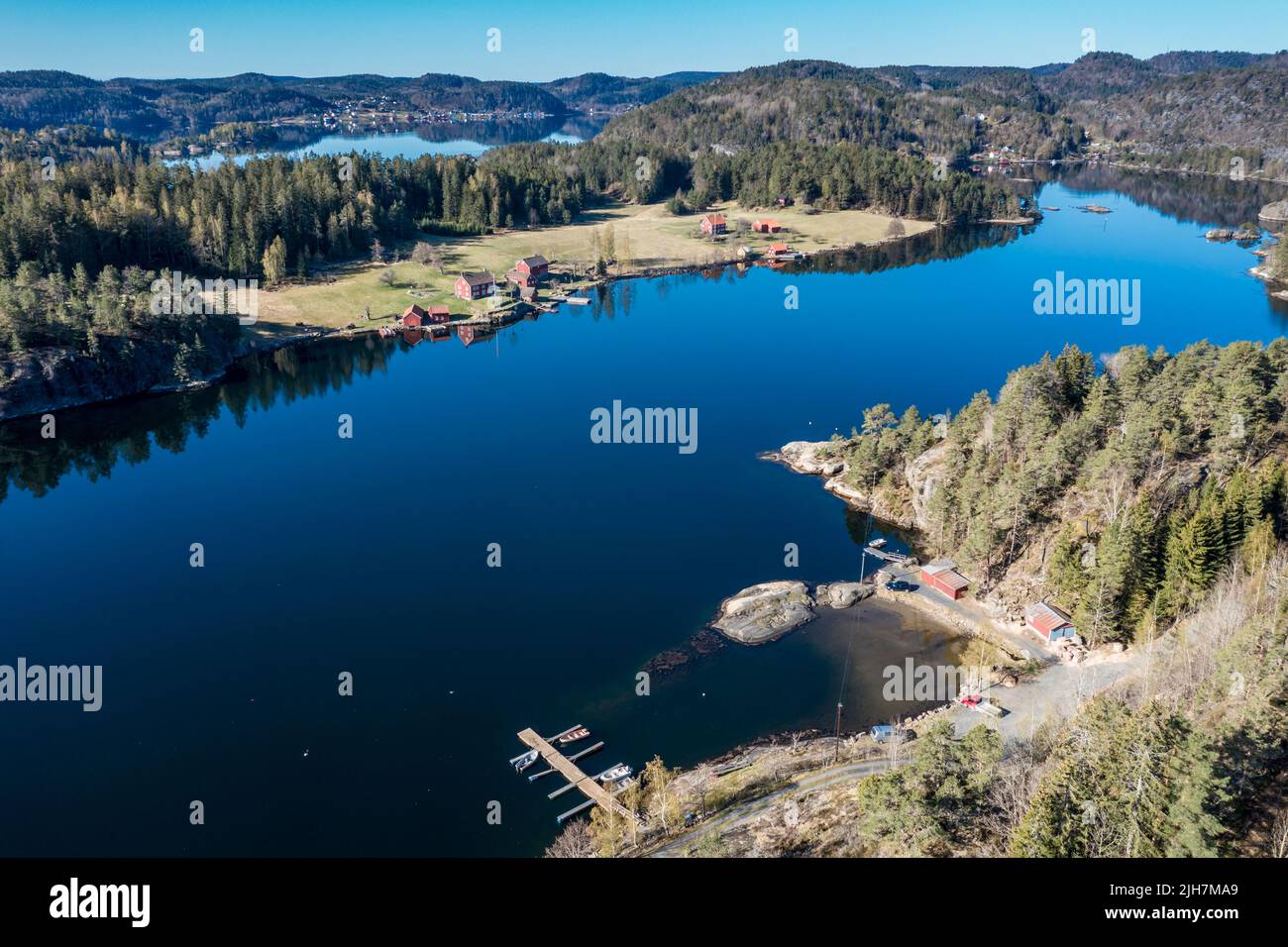Farm with red houses on an island near Risor, norwegean southern coast