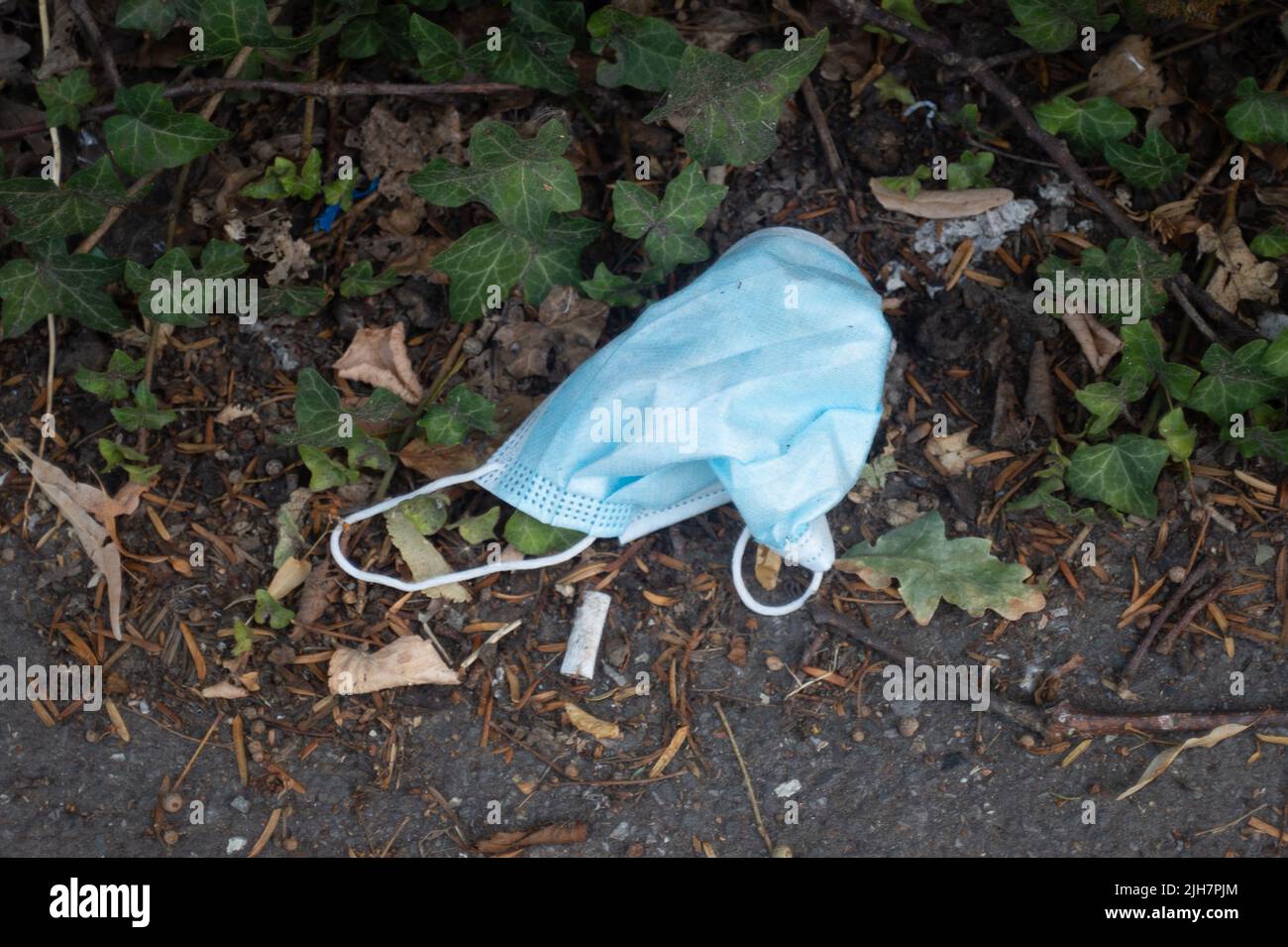 Slough, UK. 16th July, 2022. Used face masks discarded by patients