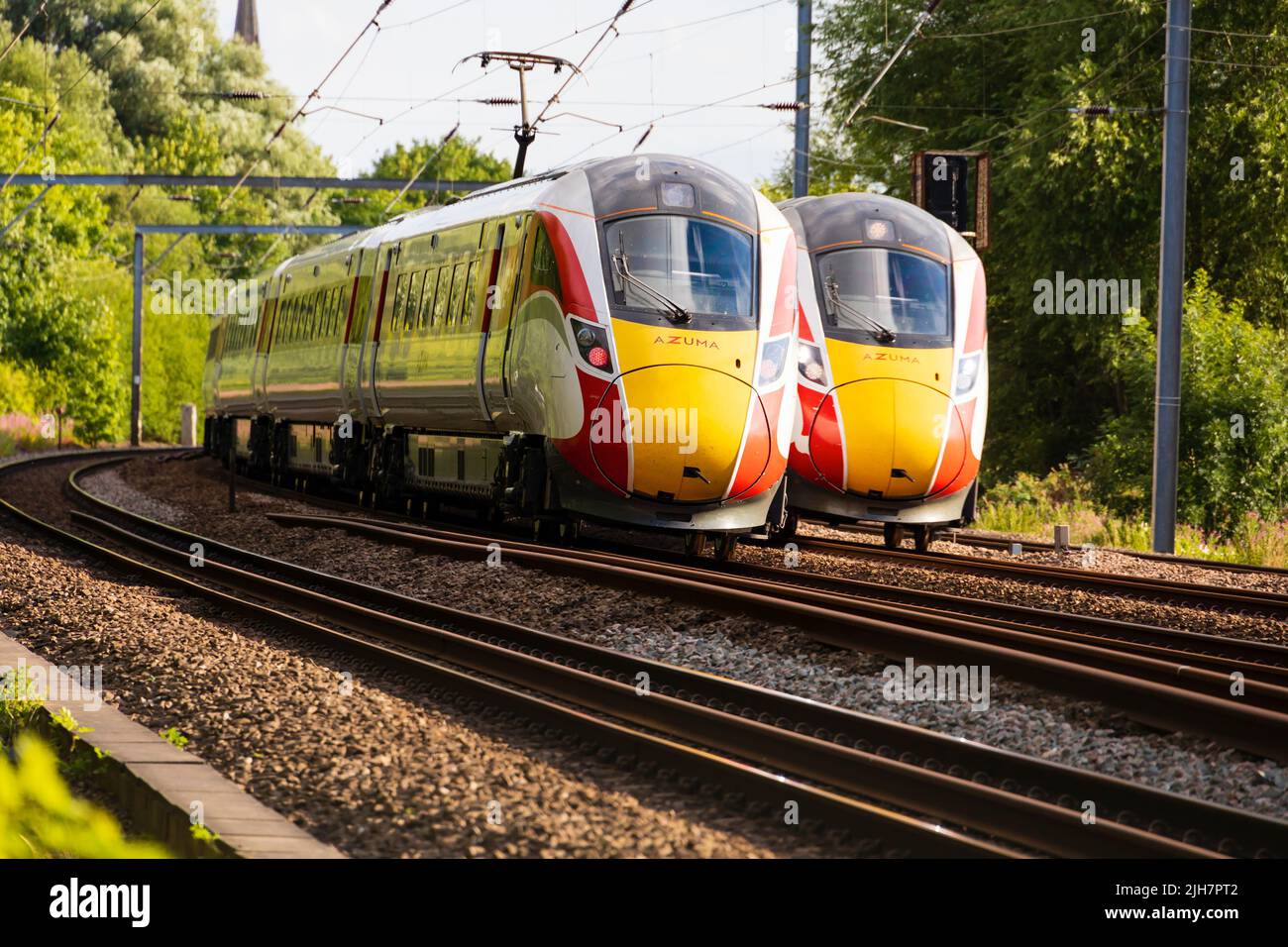 Two London North Eastern Railways 'Azuma' diesel electric hybrid trains pass each other on the East Coast Main line at Offord Cluny, Cambridgeshire, E Stock Photo