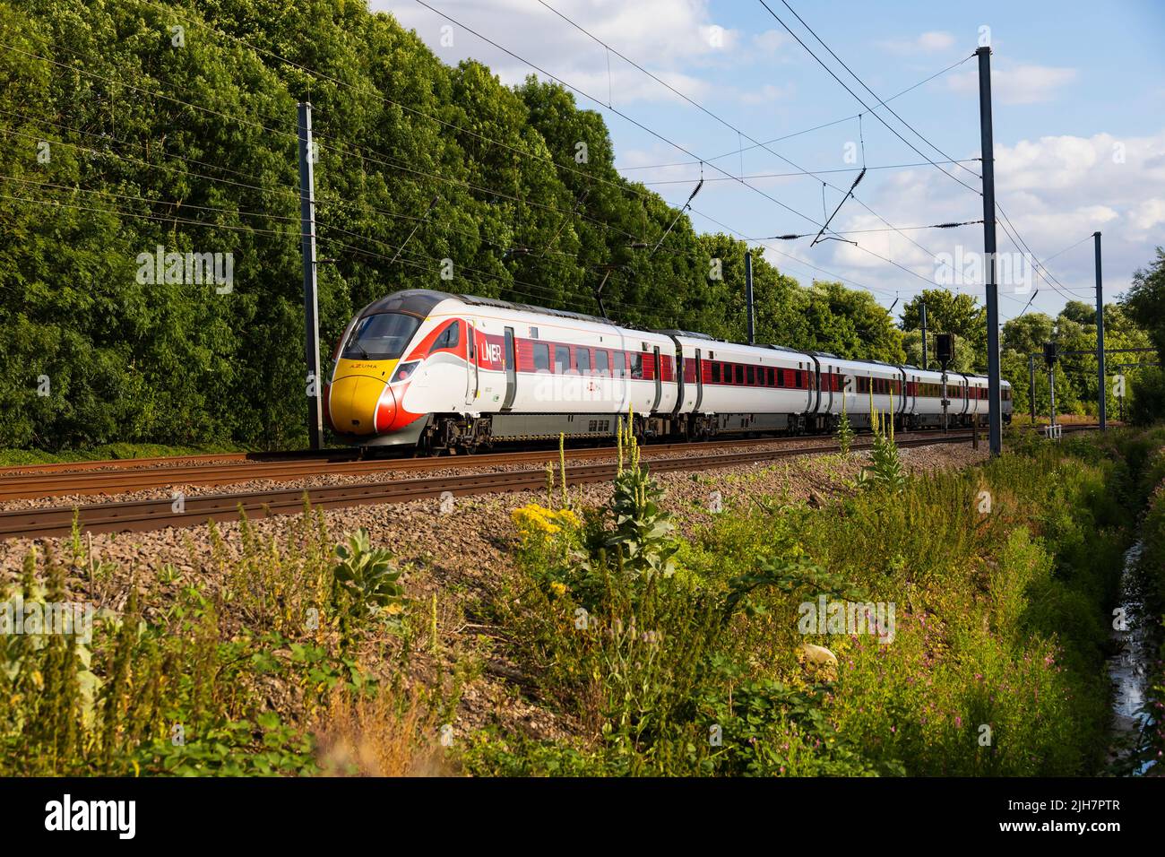 London North Eastern Railways "Azuma" diesel electric hybrid train on the East Coast Main line at Offord Cluny, Cambridgeshire, England Stock Photo