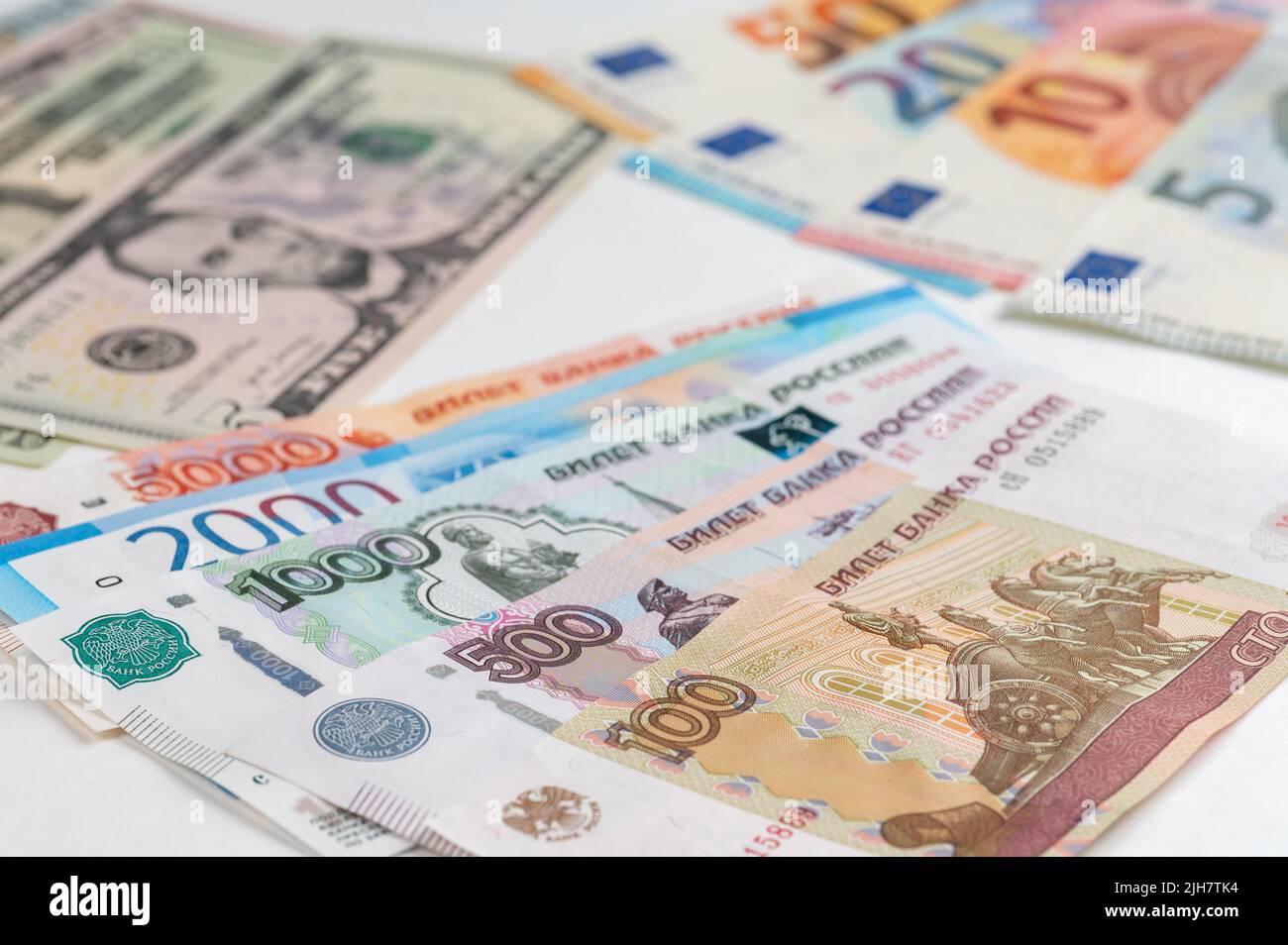 Money from different countries: dollars, euros, rubles. International currencies background. Stock Photo