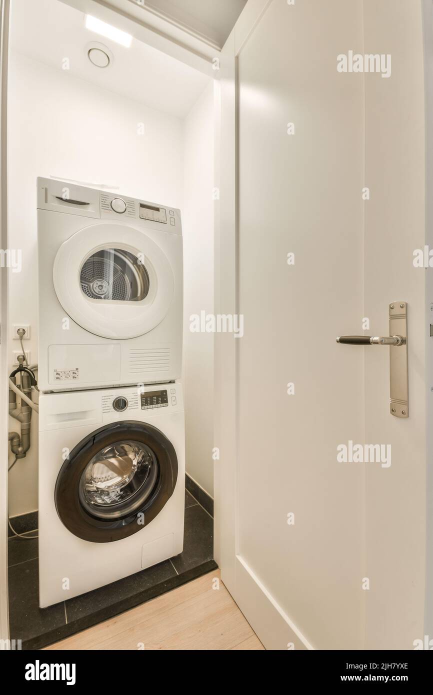 Glass partition between shower tap and wall hung toilet in modern