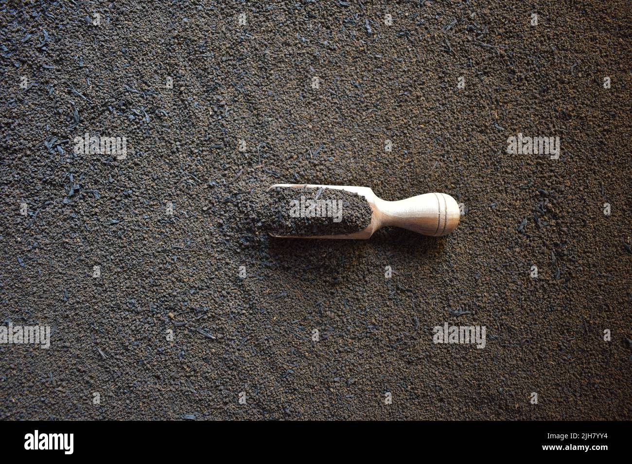Raw coarse dried tea leaves powder Stock Photo - Alamy