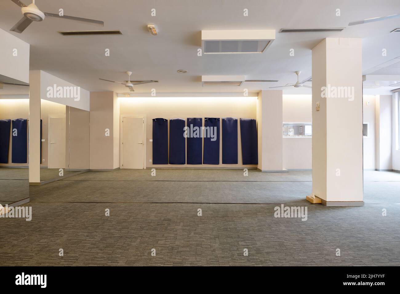 yoga exercise room with mats and padded floors Stock Photo