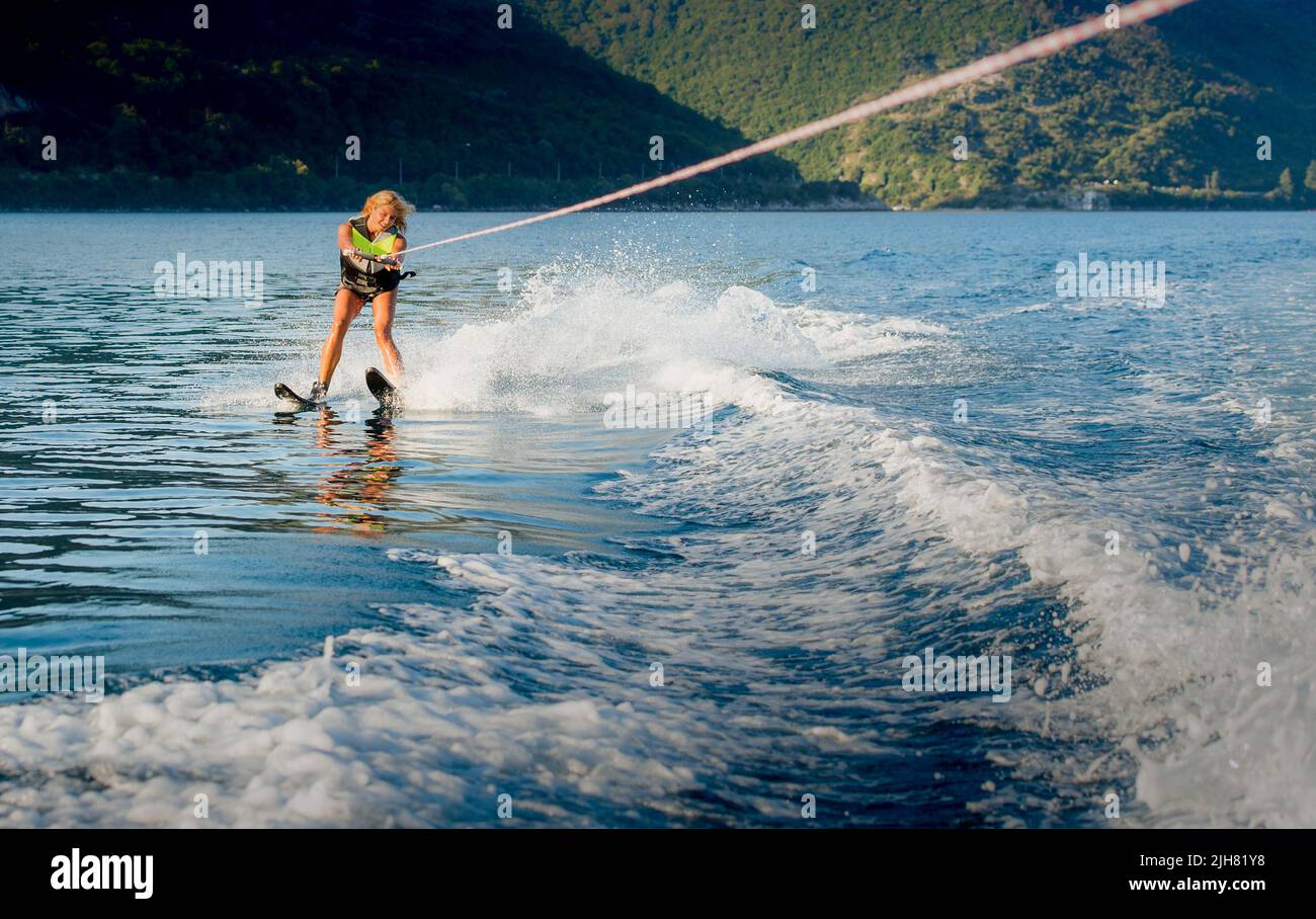 a young woman water skiing on a sea Stock Photo