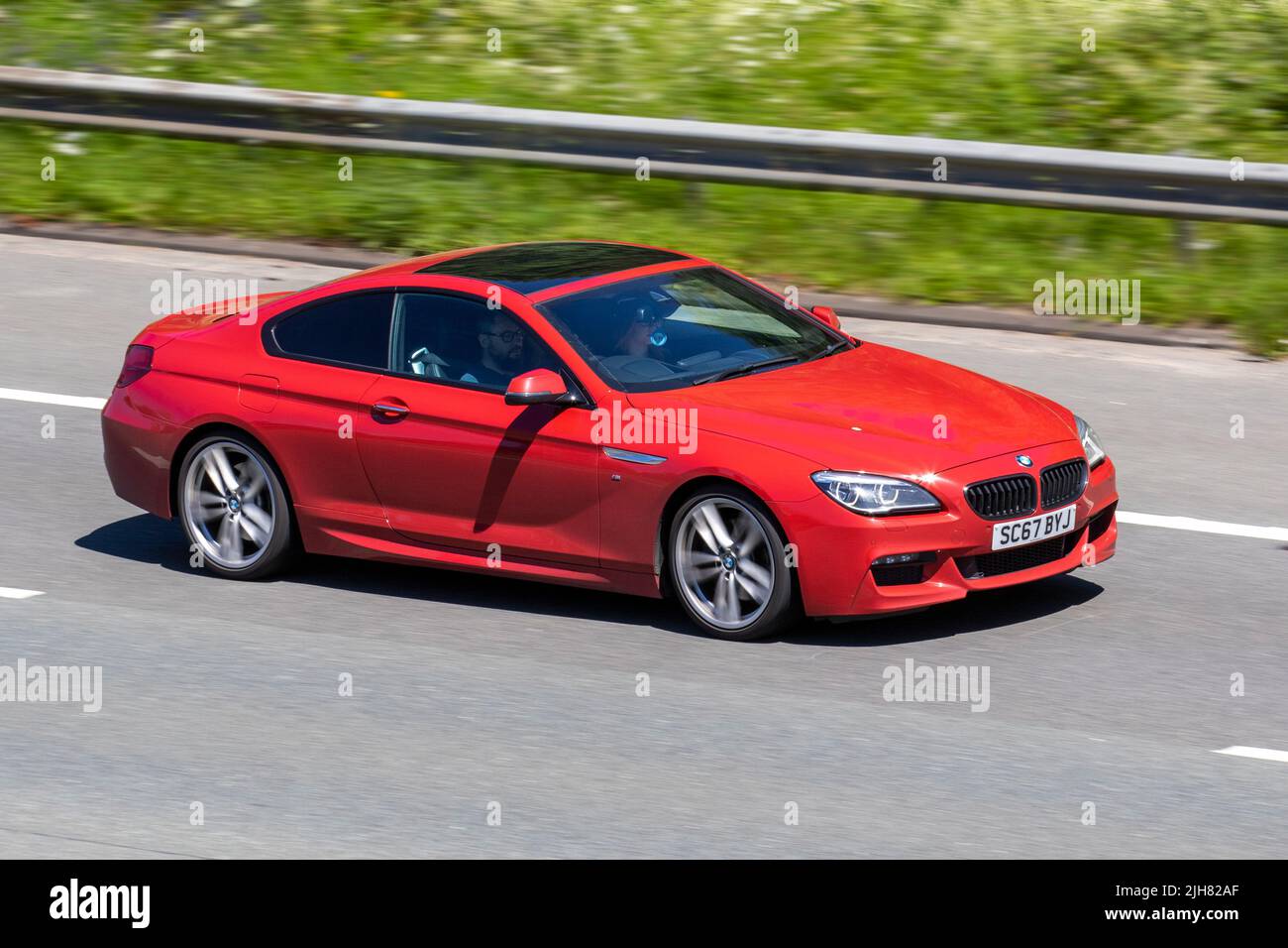 2017 red BMW 640 435D XDRIVE M SPORT 2993cc Diesel coupe 8 Speed automatic; travelling on the M6 Motorway, Manchester, UK Stock Photo