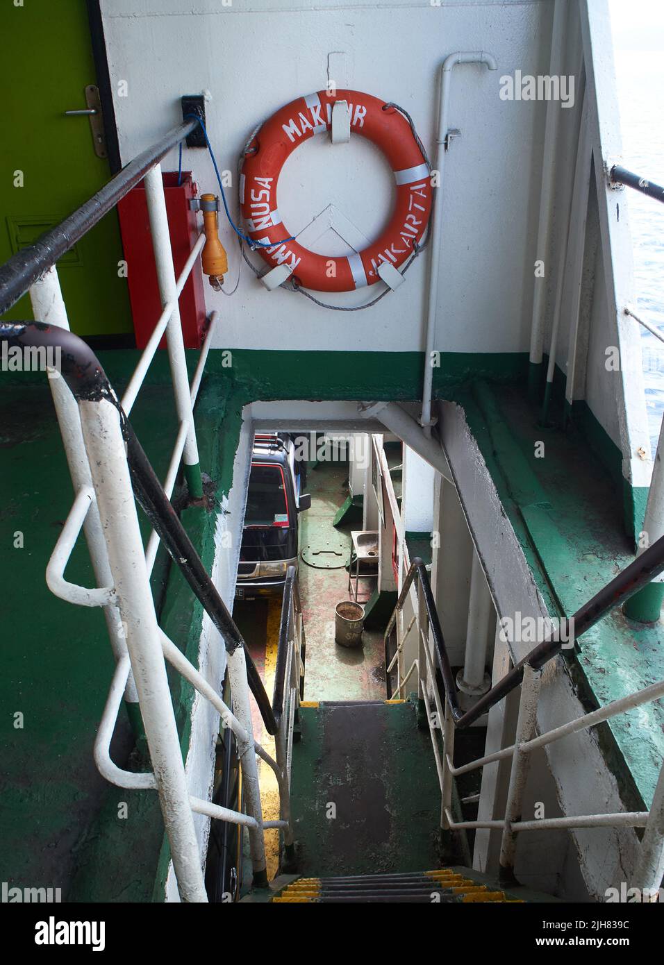 lifebuoy hanging on a ladder in a ferry Stock Photo