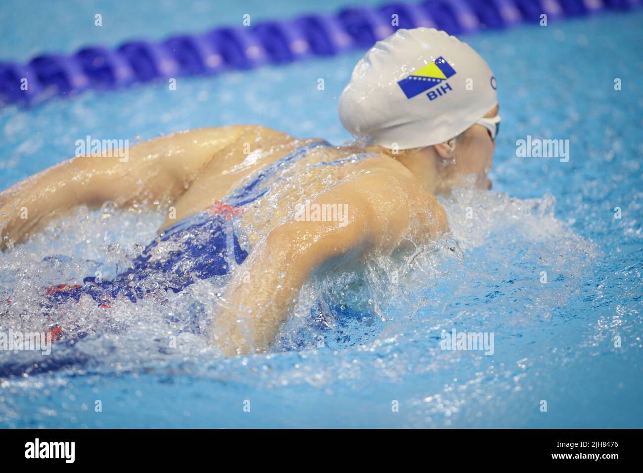 Otopeni, Romania - 8 July 2022: Details with a professional Israeli  female athlete swimming in an olympic swimming pool butterfly style. female athle Stock Photo