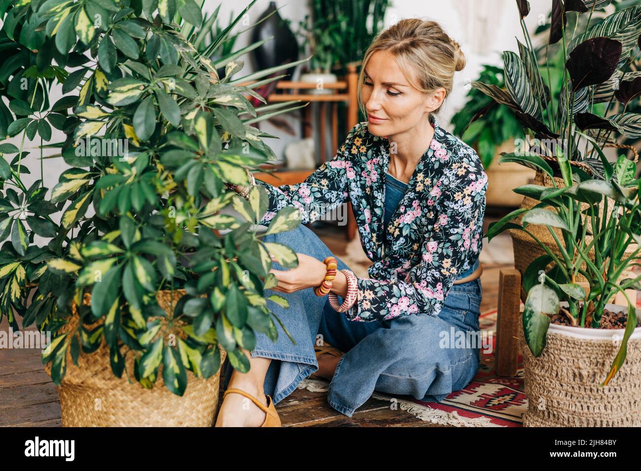 Happy young woman gardener hi-res stock photography and images - Alamy