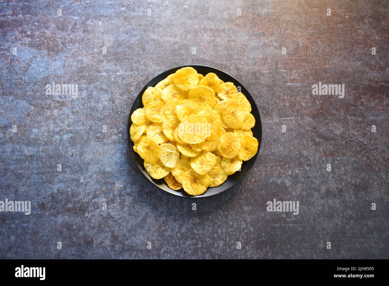 Crispy banana chips savory snack Stock Photo Alamy