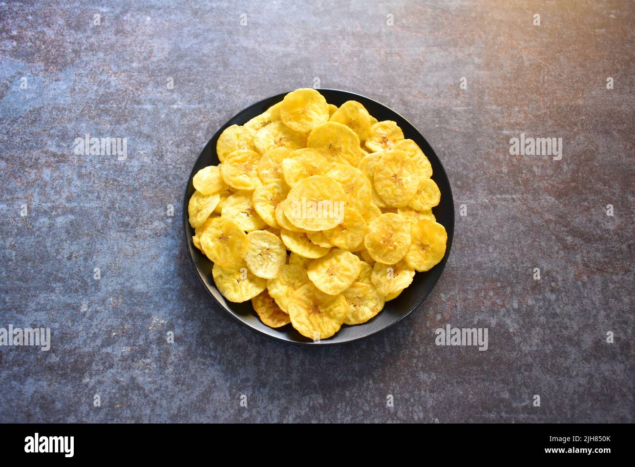 Crispy banana chips savory snack Stock Photo Alamy