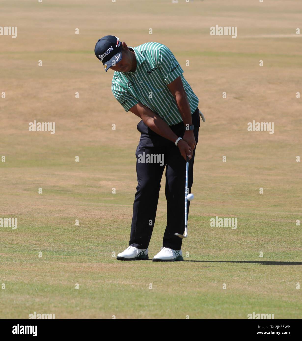 St.Andrews, UK. 16th July, 2022. Japan's Hideki Matsuyama chips onto the 18th green during the third round of the 150th Open Championship at St Andrews Golf Club in St Andrews, Scotland on Saturday, July 16, 2022. Photo by Hugo Philpott/UPI Credit: UPI/Alamy Live News Stock Photo