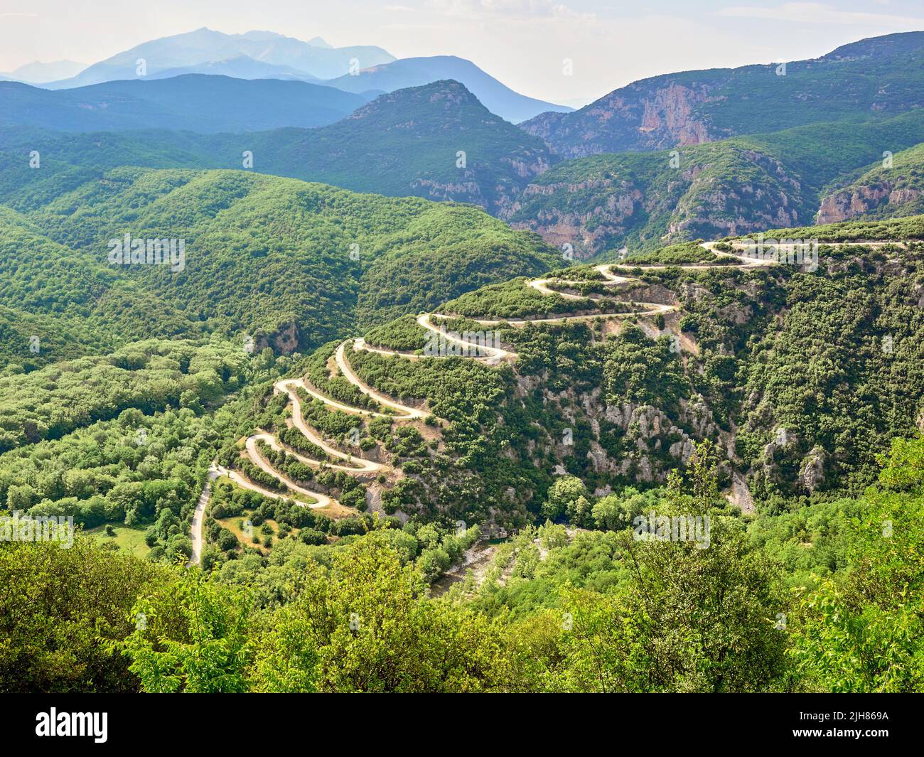 The fifteen hairpin bend ascent in the road between Aristi and Papingo in the Zagori region of northern Greece Stock Photo