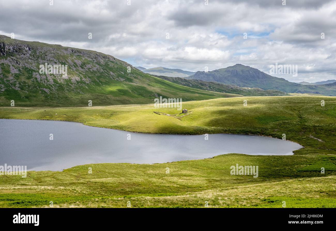 Burnmoor Tarn from the slopes of Illgill Head looking towards Harter Fell in the Lake District UK Stock Photo