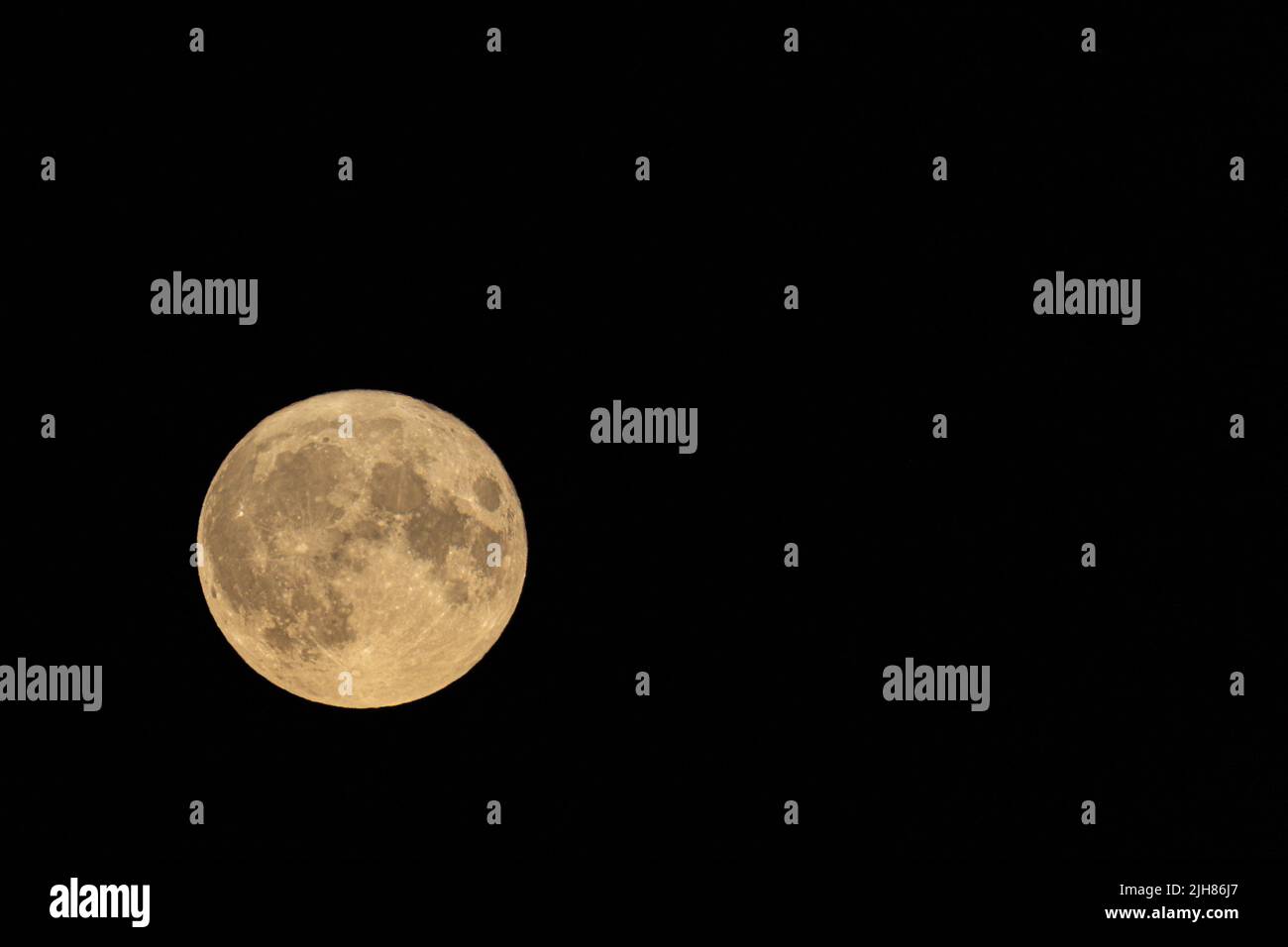Full moon supermoon at night showing craters and seas Stock Photo