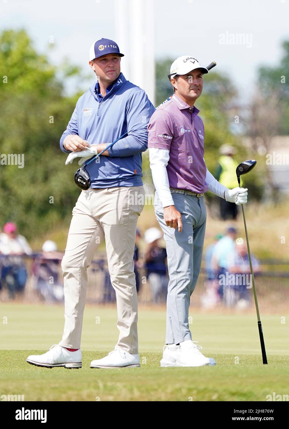 USA's Kevin Kisner (right) and USA's Trey Mullinax tee off the 18th