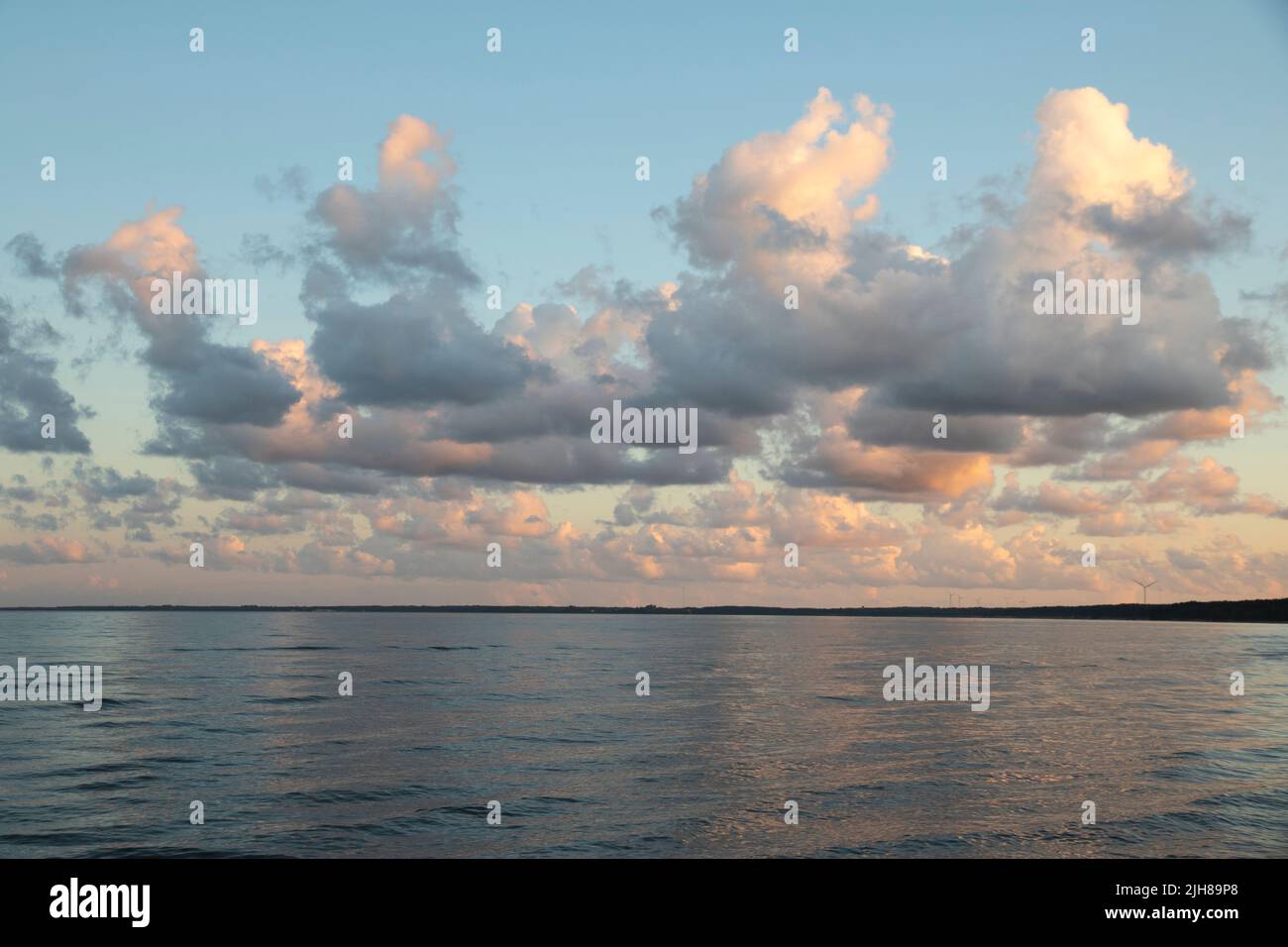 Clouds during sunset on a beach Stock Photo
