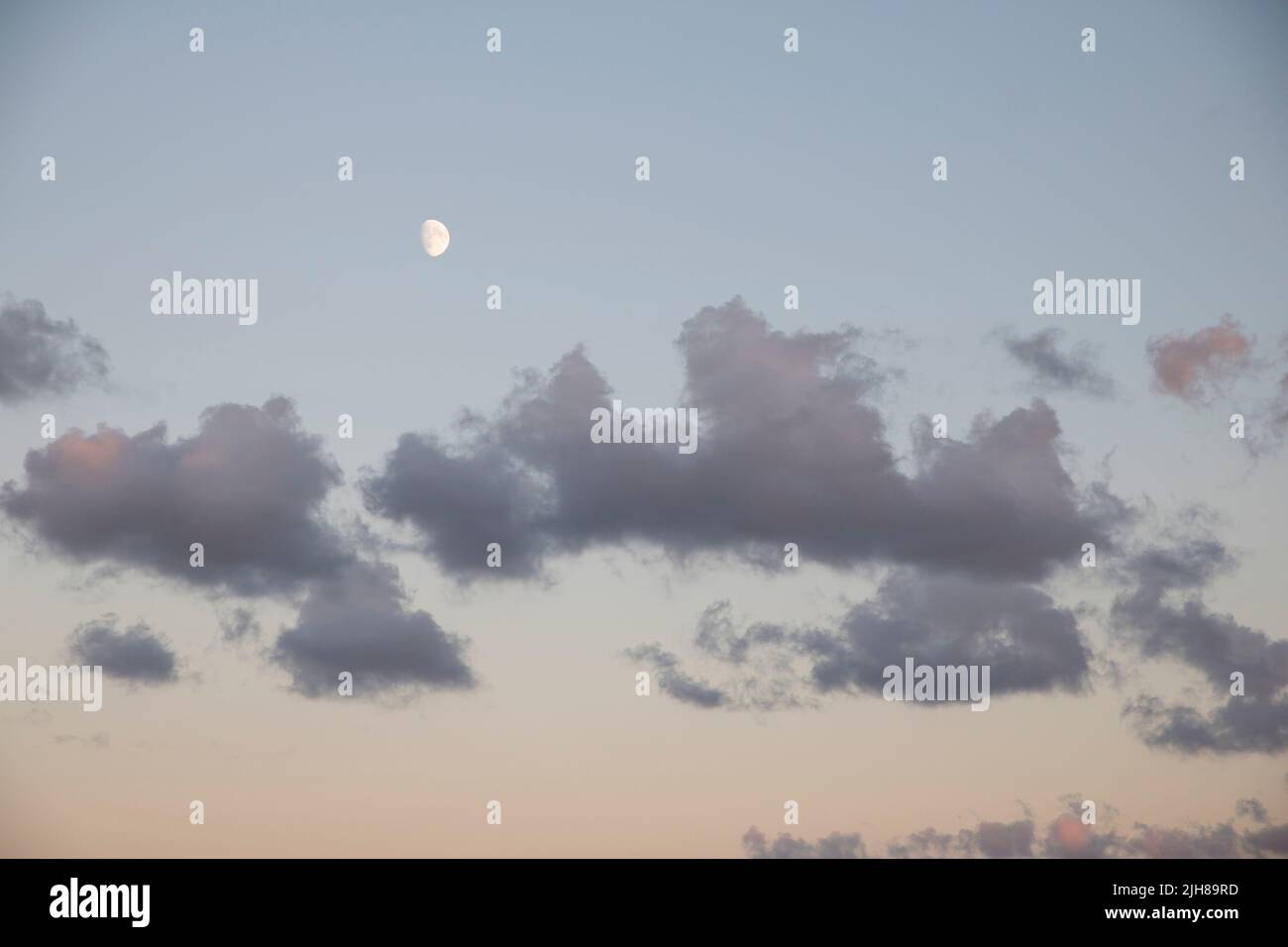Clouds during sunset on a beach Stock Photo